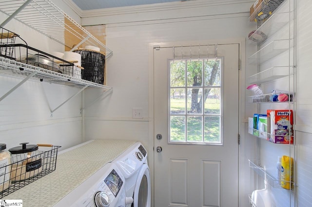 clothes washing area with washer and dryer and laundry area