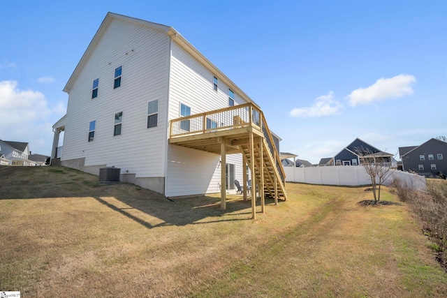 back of house with fence, stairs, central AC, a deck, and a lawn