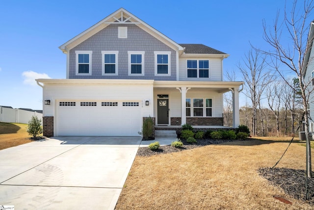 view of front facade featuring a garage, brick siding, central AC unit, concrete driveway, and a porch