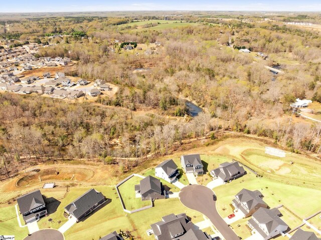 aerial view featuring a residential view and a view of trees