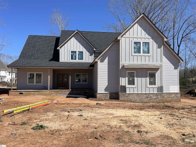 modern farmhouse style home with board and batten siding, a shingled roof, and french doors