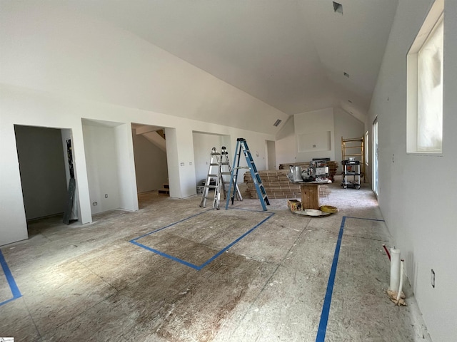 bonus room featuring stairway and lofted ceiling