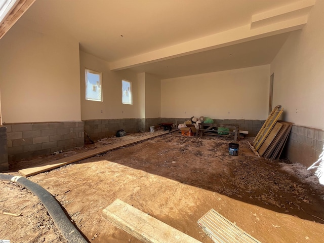 interior space featuring a wainscoted wall