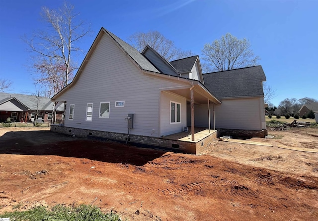 view of home's exterior featuring a shingled roof