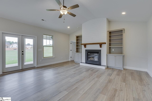 114 Walters Way, Pickens, SC 29671 - unfurnished living room featuring vaulted ceiling, a ceiling fan, a large fireplace, light wood finished floors, and baseboards