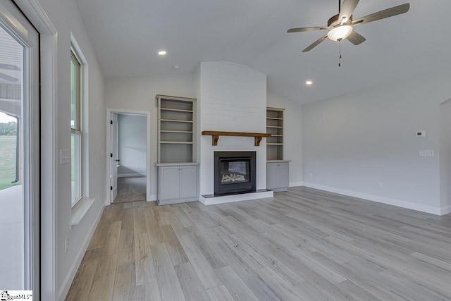 114 Walters Way, Pickens, SC 29671 - unfurnished living room featuring lofted ceiling, light wood-type flooring, a ceiling fan, a large fireplace, and baseboards