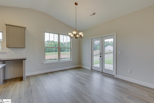 114 Walters Way, Pickens, SC 29671 - unfurnished dining area with lofted ceiling, a chandelier, plenty of natural light, light wood-type flooring, and french doors