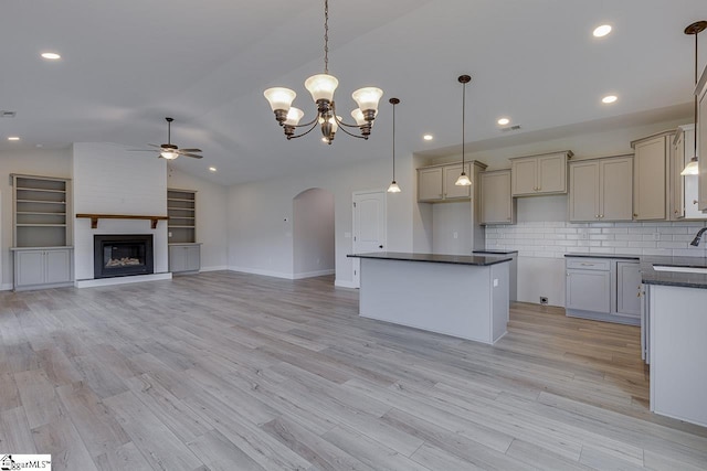 114 Walters Way, Pickens, SC 29671 - kitchen featuring ceiling fan, arched walkways, dark countertops, lofted ceiling, and a sink