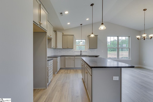 114 Walters Way, Pickens, SC 29671 - kitchen featuring dark countertops, light wood-type flooring, a sink, a chandelier, and lofted ceiling