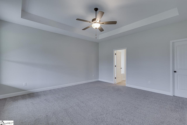 114 Walters Way, Pickens, SC 29671 - spare room with a tray ceiling, a ceiling fan, light colored carpet, and baseboards