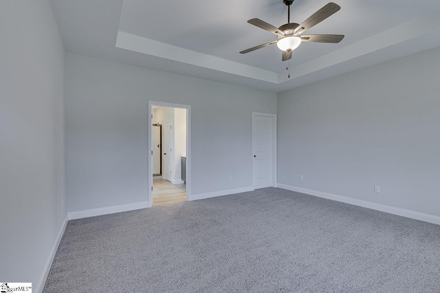 114 Walters Way, Pickens, SC 29671 - empty room featuring light carpet, a ceiling fan, a tray ceiling, and baseboards