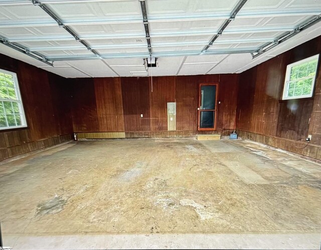 2506 E Tyger Bridge Rd, Greer, SC 29651 - garage featuring wood walls and a garage door opener