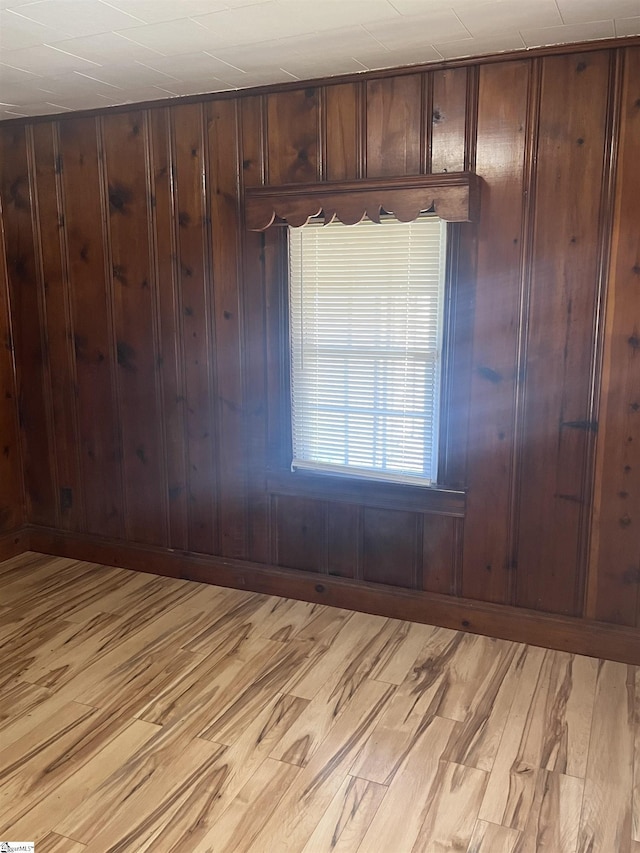 1273 Powerhouse Rd, Ware Shoals, SC 29692 - unfurnished room featuring light wood-style flooring, wood walls, and baseboards
