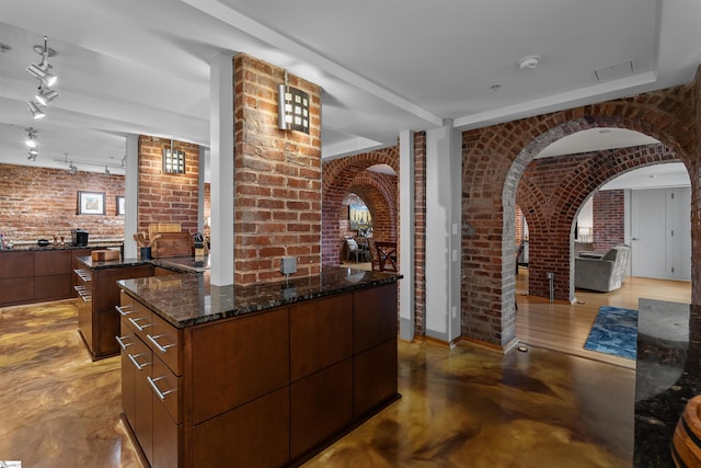 400 E Washington St Unit 28, Greenville, SC 29601 - bar with concrete floors, arched walkways, brick wall, visible vents, and track lighting