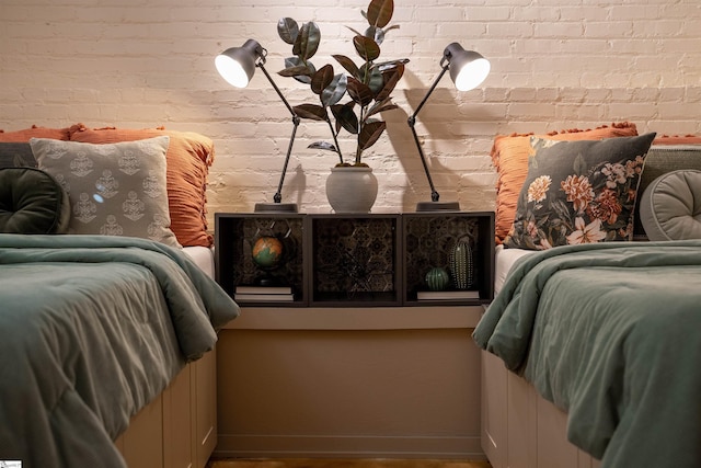 400 E Washington St Unit 28, Greenville, SC 29601 - bedroom featuring baseboards and brick wall