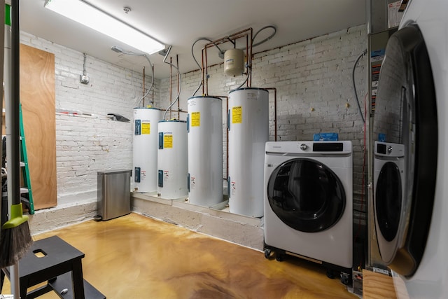 400 E Washington St Unit 28, Greenville, SC 29601 - clothes washing area with water heater, separate washer and dryer, and brick wall