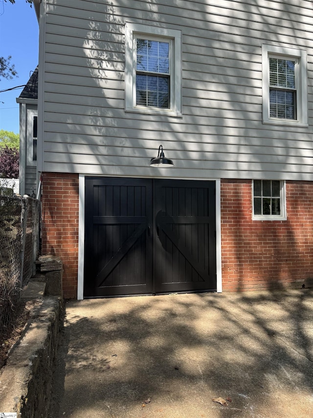 332 Grove Rd, Greenville, SC 29605 - garage featuring fence and driveway