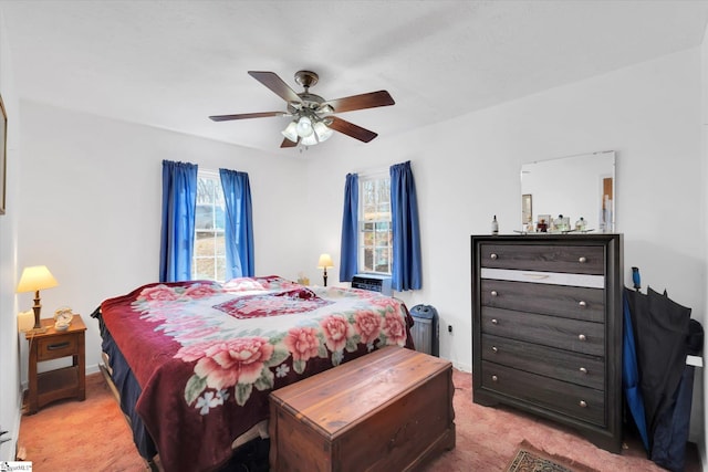 carpeted bedroom with a ceiling fan