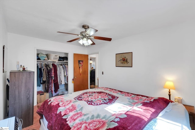 carpeted bedroom featuring a closet and a ceiling fan