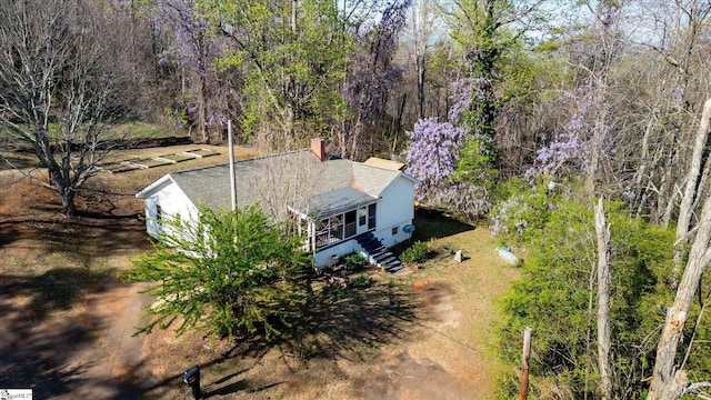 drone / aerial view featuring a view of trees