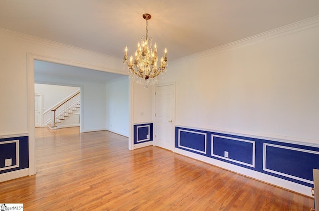 206 Chelsea Ln, Greer, SC 29650 - empty room with crown molding, wood finished floors, stairway, and a notable chandelier