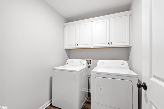 laundry area with baseboards, cabinet space, and washer and clothes dryer