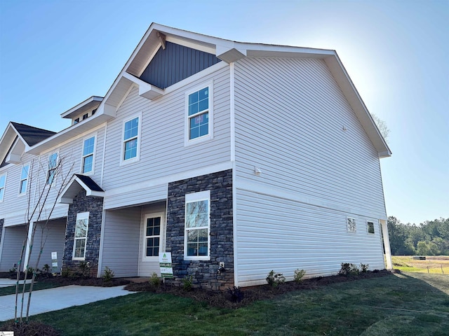 219 Islay Way, Anderson, SC 29621 - exterior space featuring stone siding, board and batten siding, and a front lawn