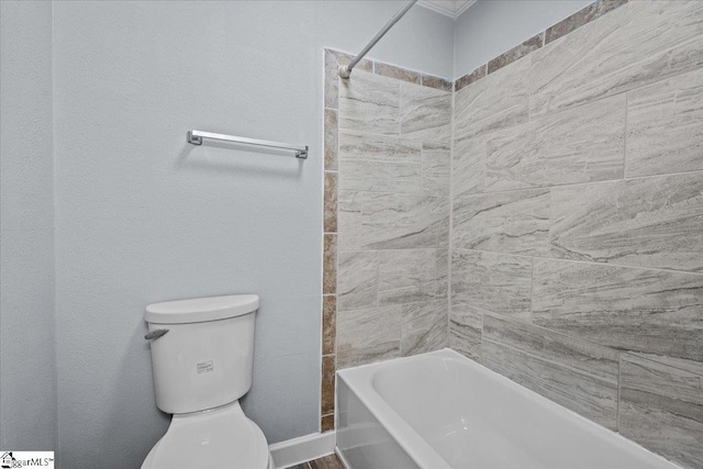 bathroom featuring toilet and shower / bathtub combination