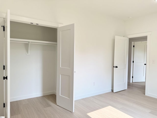 1221 Humphries Rd, Cowpens, SC 29330 - unfurnished bedroom with light wood-style floors, baseboards, and a closet