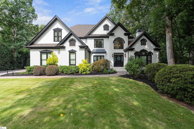3 Bailey Knoll Ct, Simpsonville, SC 29681 - french country style house with a front lawn, brick siding, and roof with shingles
