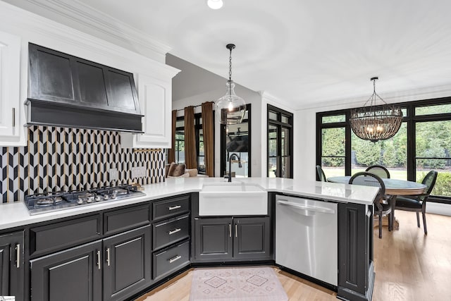3 Bailey Knoll Ct, Simpsonville, SC 29681 - kitchen featuring light countertops, a peninsula, stainless steel appliances, white cabinetry, and a sink