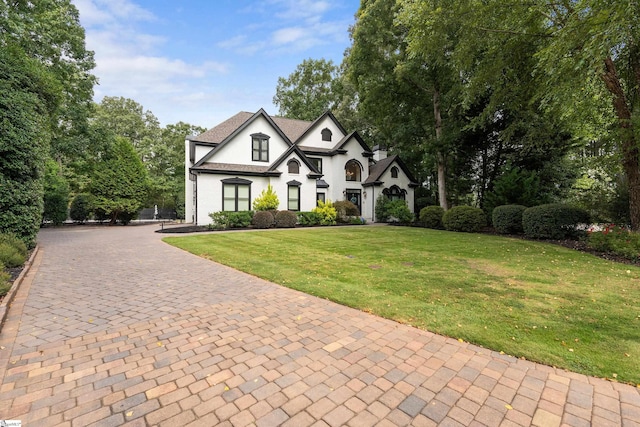 3 Bailey Knoll Ct, Simpsonville, SC 29681 - view of front facade with stucco siding, a shingled roof, a front yard, and decorative driveway