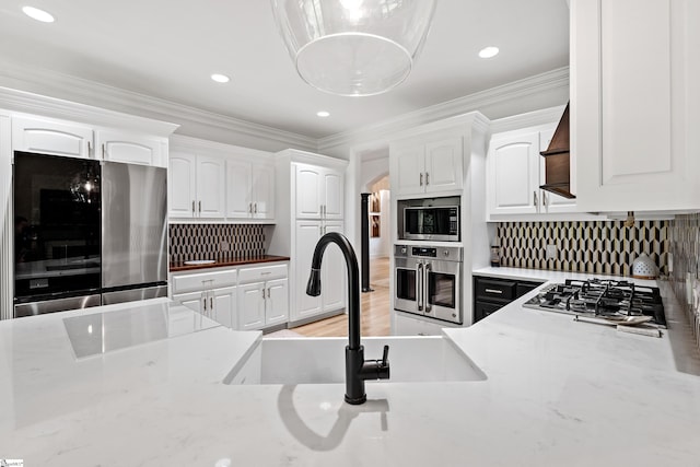 3 Bailey Knoll Ct, Simpsonville, SC 29681 - kitchen with white cabinets, a sink, appliances with stainless steel finishes, and crown molding