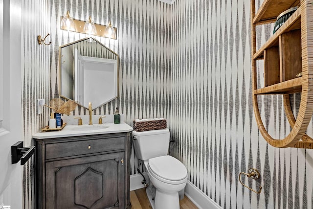 3 Bailey Knoll Ct, Simpsonville, SC 29681 - bathroom with vanity, toilet, baseboards, wallpapered walls, and wood finished floors
