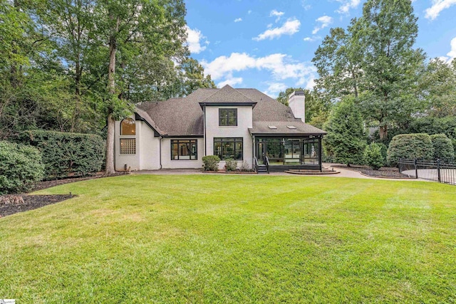 3 Bailey Knoll Ct, Simpsonville, SC 29681 - rear view of house with a sunroom, roof with shingles, fence, a yard, and a chimney