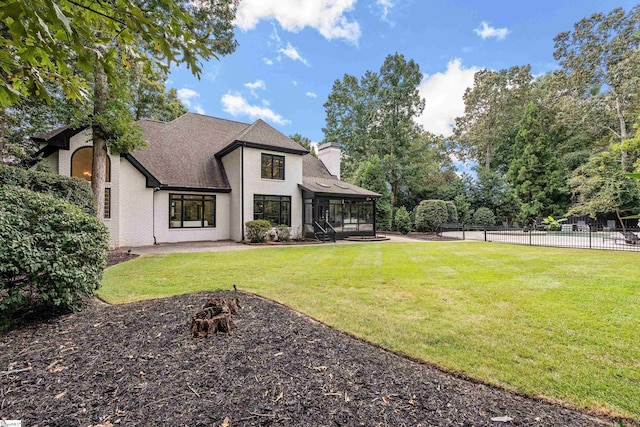 3 Bailey Knoll Ct, Simpsonville, SC 29681 - rear view of property featuring a sunroom, fence, brick siding, a yard, and a chimney