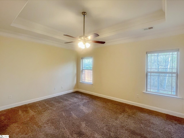 410 Airdale Ln, Simpsonville, SC 29680 - unfurnished room with a tray ceiling, dark colored carpet, visible vents, ceiling fan, and ornamental molding