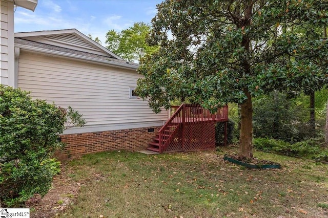 view of yard featuring stairs and a deck