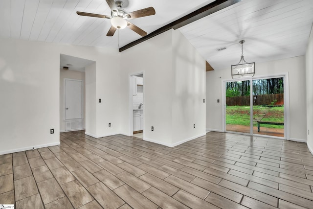 unfurnished room with lofted ceiling with beams, ceiling fan with notable chandelier, baseboards, and visible vents