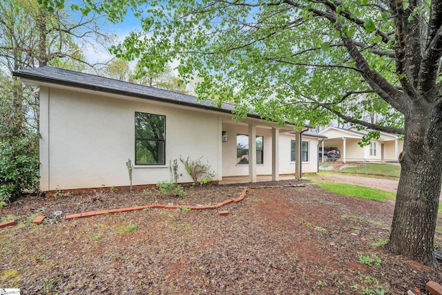 ranch-style house with stucco siding