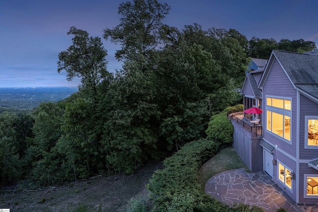 39 The Cliffs Pkwy, Landrum, SC 29356 - property exterior at dusk featuring roof with shingles