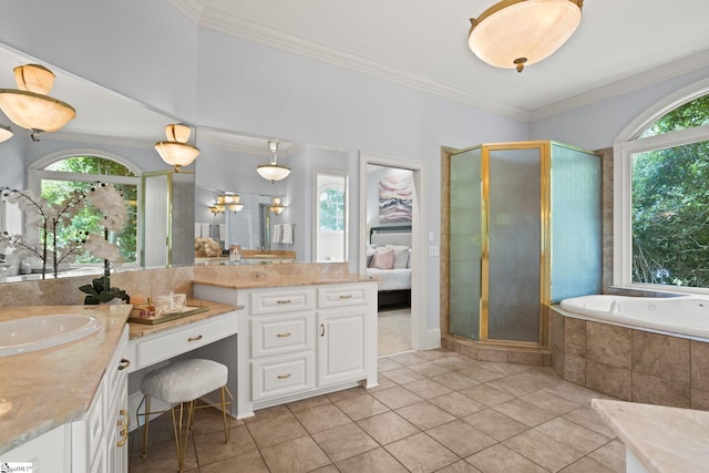 ensuite bathroom featuring vanity, crown molding, a garden tub, and a shower stall