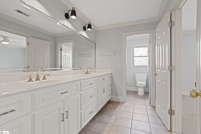 full bathroom with visible vents, crown molding, double vanity, toilet, and tile patterned floors
