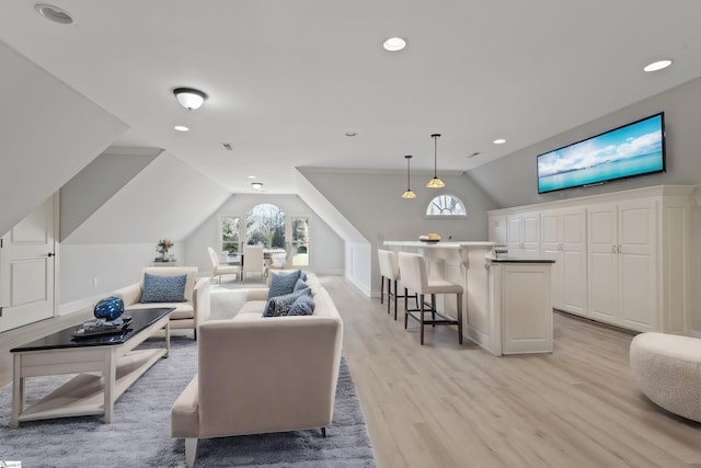 living room with baseboards, vaulted ceiling, recessed lighting, and light wood-type flooring