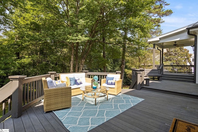 deck featuring a ceiling fan and outdoor lounge area