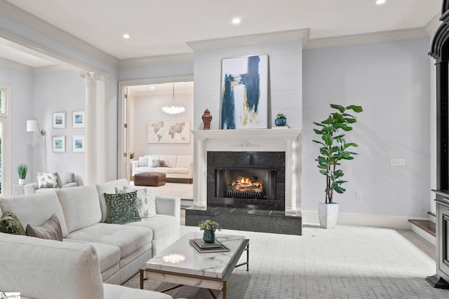 living area featuring carpet flooring, a fireplace, baseboards, ornamental molding, and recessed lighting