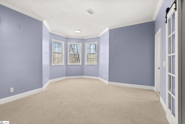 spare room with baseboards, ornamental molding, visible vents, and light carpet