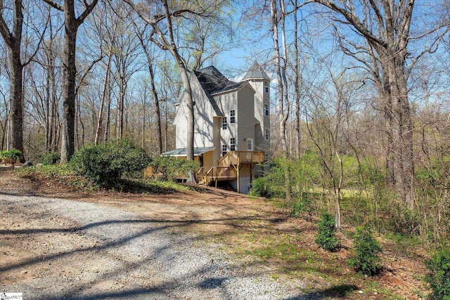 view of property exterior featuring a deck