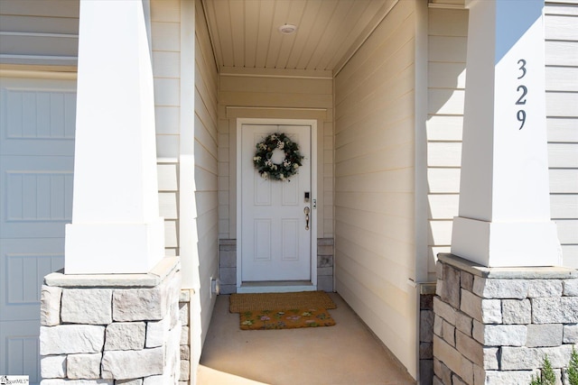 entrance to property featuring a garage