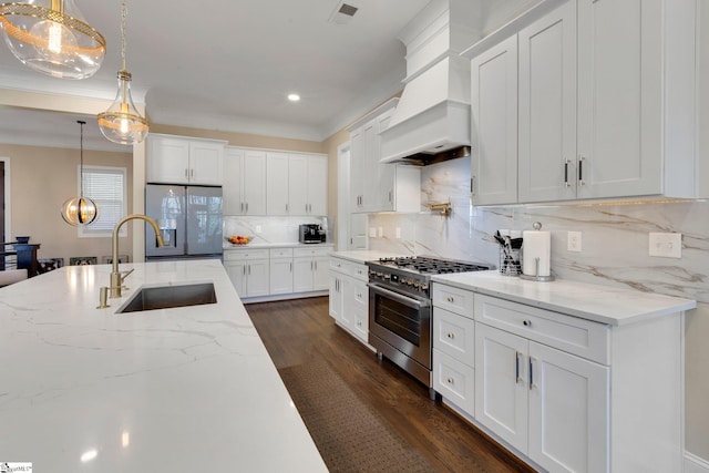 9 Graywood Ct, Simpsonville, SC 29680 - kitchen featuring a sink, custom exhaust hood, high end stainless steel range oven, visible vents, and fridge with ice dispenser